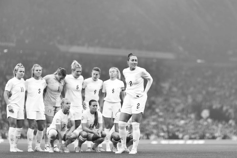 MANCHESTER, ENGLAND - JULY 06: Lucy Bronze of England looks on as England pose for a team photo during the UEFA Women's Euro England 2022 group A match between England and Austria at Old Trafford on July 06, 2022 in Manchester, England. (Photo by Naomi Baker/Getty Images)