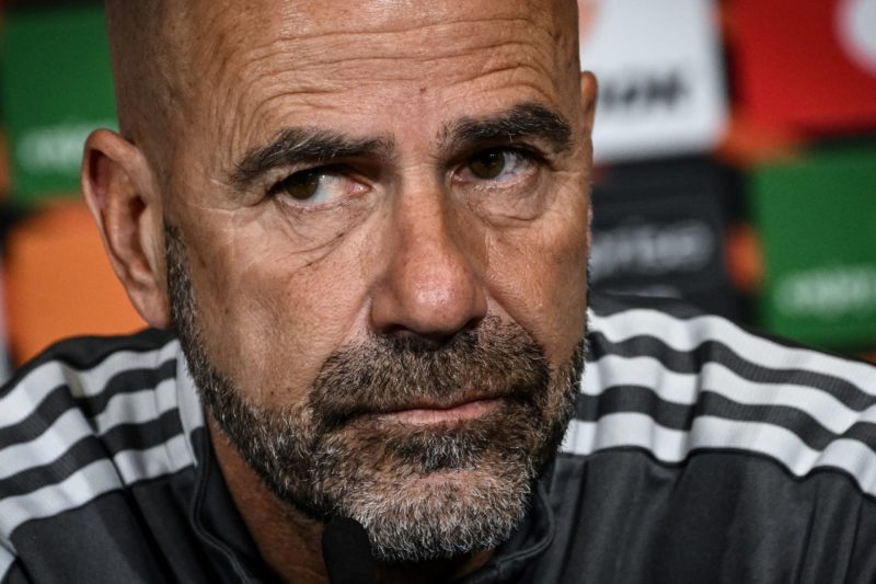 Lyon's Dutch coach Peter Bosz answers to journalists' questions during a press conference at the Groupama stadium in Decines-Charpieu near Lyon, central eastern France, on April 13, 2022, on the eve of the UEFA Europa League quarter final second leg football match between Olympique Lyonnais (OL) and West Ham United. (Photo by JEFF PACHOUD / AFP) (Photo by JEFF PACHOUD/AFP via Getty Images)