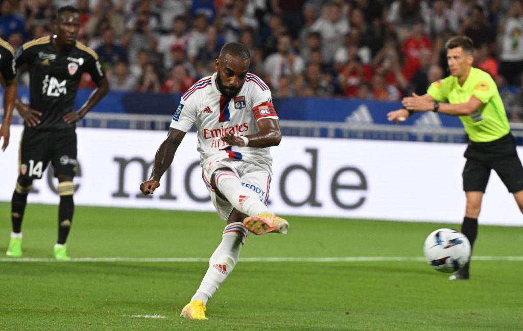 Lyon's French forward Alexandre Lacazette kicks to score his team's second goal on a penalty during the French Ligue 1 football match between Olympique Lyonnais (OL) and Ajaccio at The Groupama Stadium in Decines-Charpieu, central-eastern France, on August 5, 2022. (Photo by JEAN-PHILIPPE KSIAZEK/AFP via Getty Images)