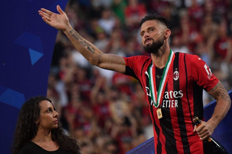 AC Milan's French forward Olivier Giroud acknowledges fans during the winner's trophy ceremony after AC Milan won the Italian Serie A football match between Sassuolo and AC Milan, securing the "Scudetto" championship on May 22, 2022 at the Mapei - Citta del Tricolore stadium in Sassuolo. (Photo by Tiziana FABI / AFP) (Photo by TIZIANA FABI/AFP via Getty Images)