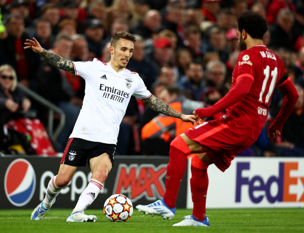 LIVERPOOL, ENGLAND: Alejandro Grimaldo of Benfica attempts to move past Mohamed Salah of Liverpool during the UEFA Champions League Quarter Final Leg Two match between Liverpool FC and SL Benfica at Anfield on April 13, 2022. (Photo by Clive Brunskill/Getty Images)