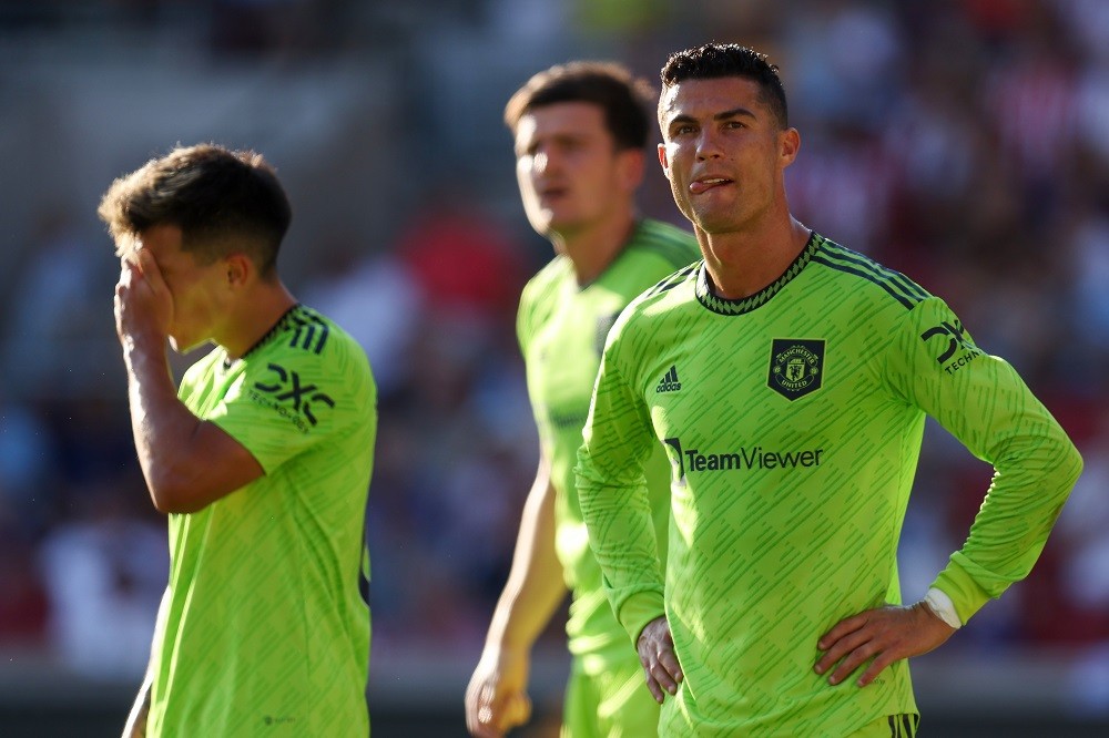 BRENTFORD, ENGLAND: Cristiano Ronaldo and Lisandro Martinez of Manchester United look dejected during the Premier League match between Brentford FC and Manchester United at Brentford Community Stadium on August 13, 2022. (Photo by Catherine Ivill/Getty Images)