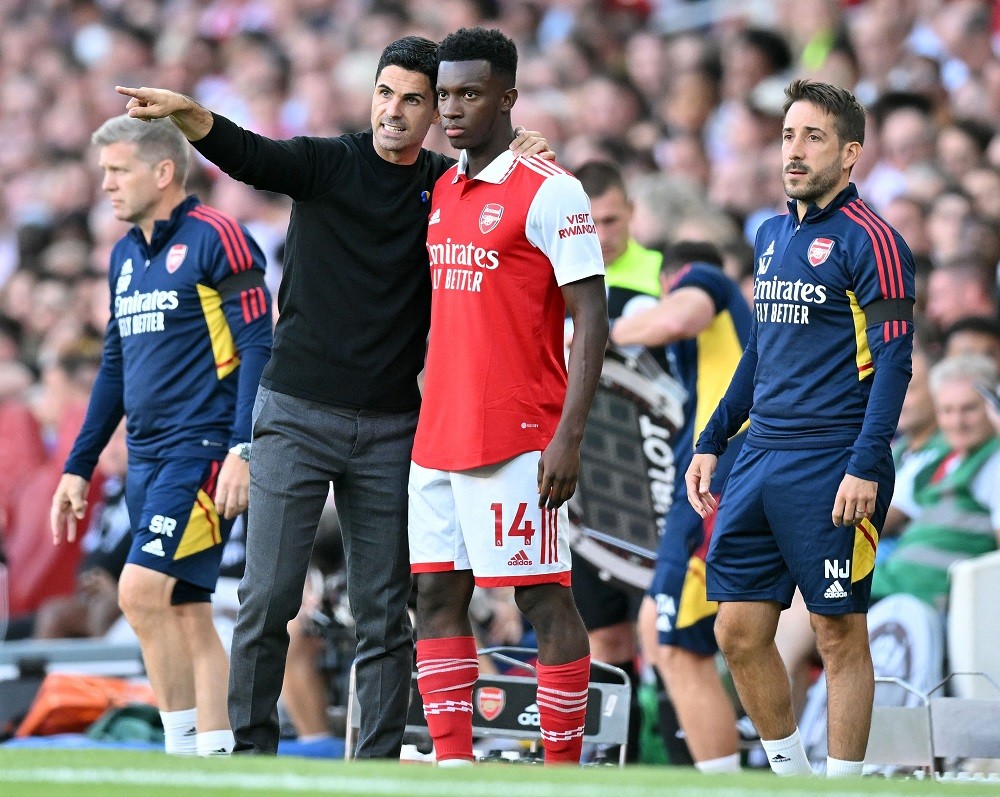 Arsenal's Spanish manager Mikel Arteta speaks to Arsenal's English striker Eddie Nketiah during the English Premier League football match between Arsenal and Fulham at the Emirates Stadium in London on August 27, 2022. (Photo by GLYN KIRK/AFP via Getty Images)