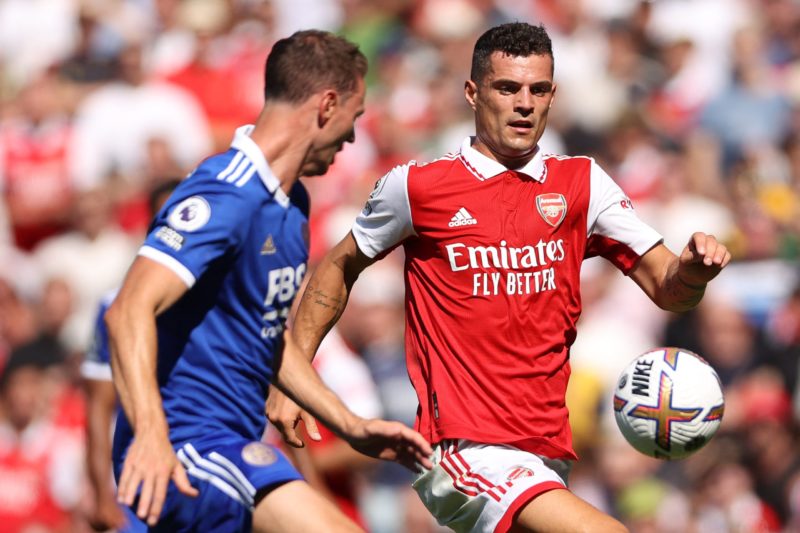 Arsenal's Swiss midfielder Granit Xhaka (R) vies with Leicester City's Northern Irish defender Jonny Evans (L) during the English Premier League football match between Arsenal and Leicester City at the Emirates Stadium in London on August 13, 2022. (Photo by ADRIAN DENNIS/AFP via Getty Images)