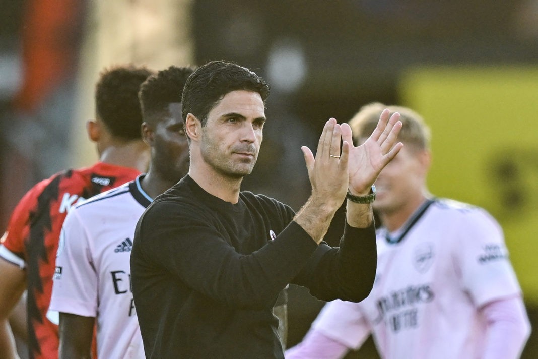 Arsenal's Spanish manager Mikel Arteta (front) applauds as he celebrates with his players after winning at the end of the English Premier League football match between Bournemouth and Arsenal at the Vitality Stadium in Bournemouth, southern England on August 20, 2022. - Arsenal won 3 - 0 against Bournemouth.(Photo by GLYN KIRK/AFP via Getty Images)