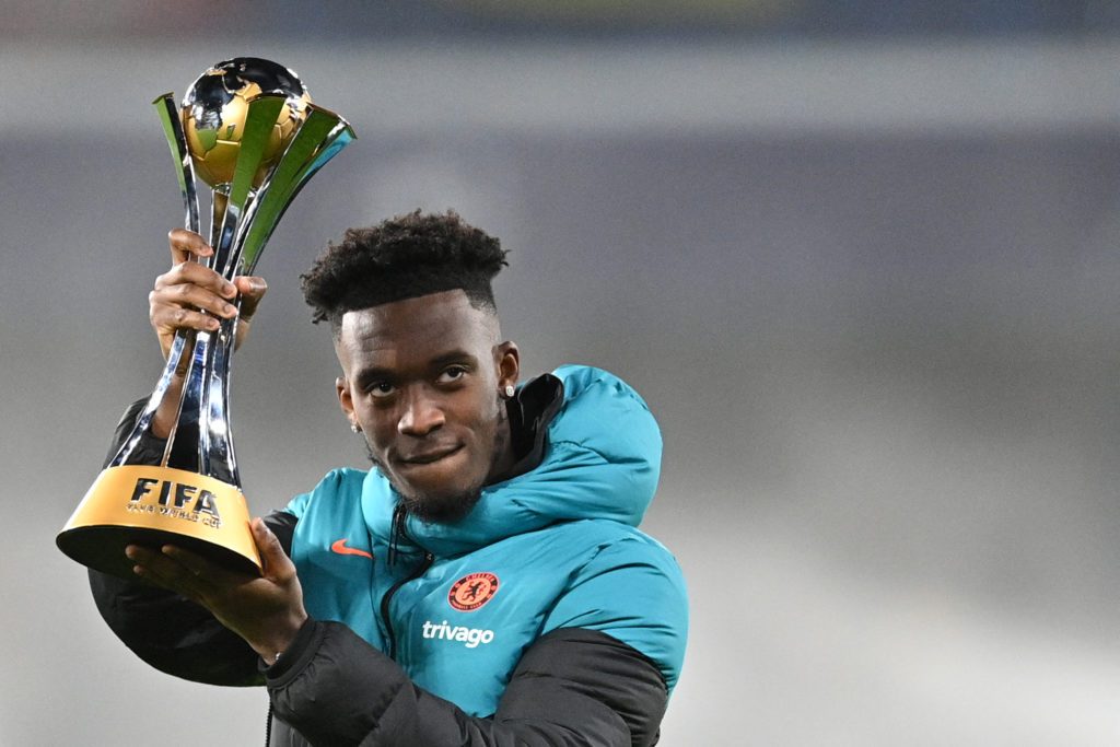 Chelsea's English midfielder Callum Hudson-Odoi shows the Club World Cup trophy to supporters prior to the start of the UEFA Champions League round of 16 first leg football match between Chelsea and Lille (LOSC) at Stamford Bridge stadium, in London, on February 22, 2022. (Photo by JUSTIN TALLIS / AFP) (Photo by JUSTIN TALLIS/AFP via Getty Images)