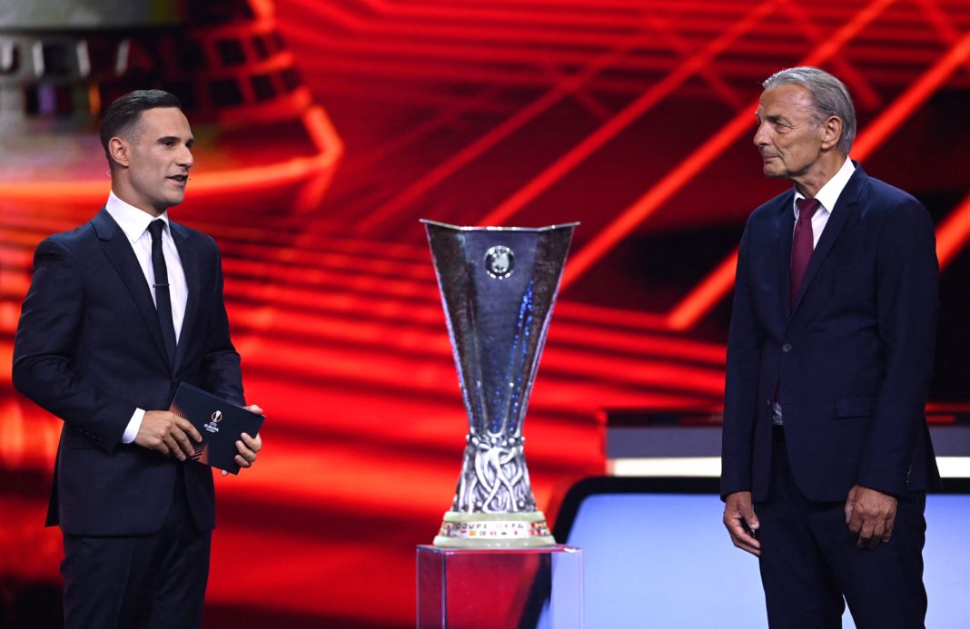 Sports journalist and presenter Adriano del Monte (L) and Former German football player Karl-Heinz Korbel (R) attend the draw for the UEFA Europa League football tournament group stage 2022-2023 in Istanbul on August 26, 2022. (Photo by OZAN KOSE / AFP) (Photo by OZAN KOSE/AFP via Getty Images)