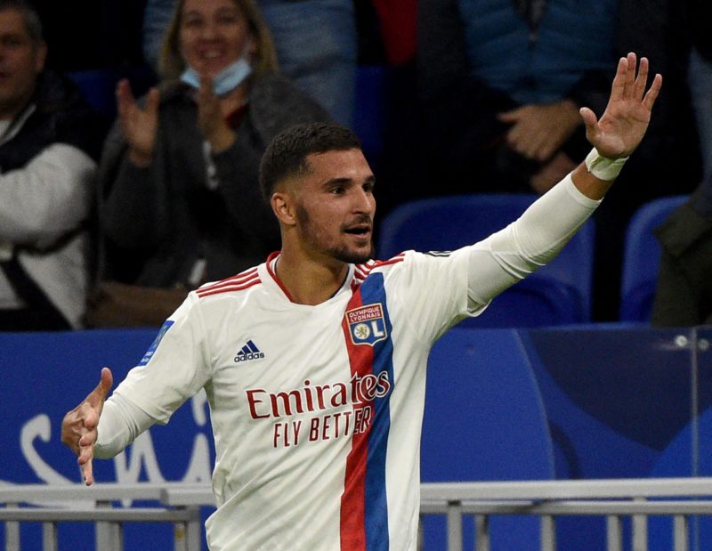 Lyon's French midfielder Houssem Aouar (C) celebrates after scoring during the French L1 football match between Olympique Lyonnais (OL) and RC Lens at The Groupama Stadium in Decines-Charpieu, central-eastern France on October 30, 2021. (Photo by JEAN-PHILIPPE KSIAZEK/AFP via Getty Images)