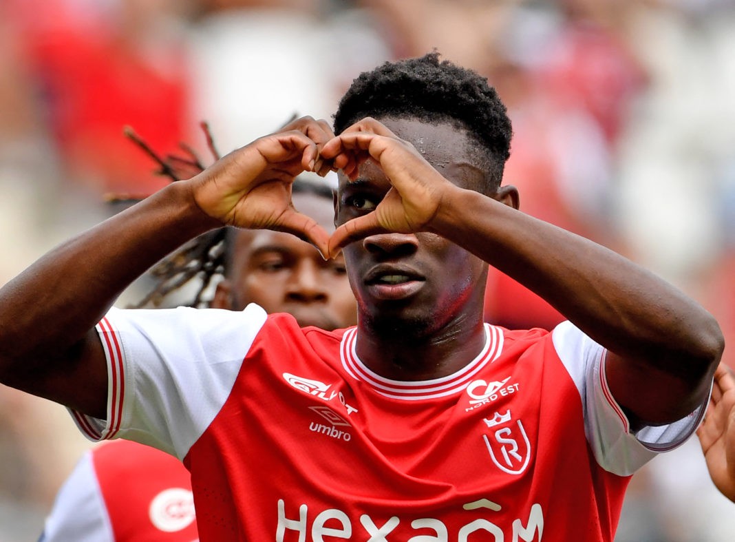 Reims' English forward Folarin Balogun celebrates after scoring a penalty kick in the French L1 football match between Stade de Reims and Clermont Foot 63 at the Stade Auguste-Delaune in Reims, northeast France, on August 14, 2022.  (Photo by FRANCOIS LO PRESTI/AFP via Getty Images)