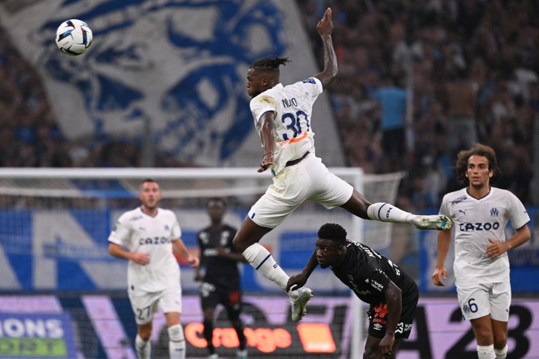 Marseille's Portuguese midfielder Nuno Tavares (C) heads the ball during the French L1 football match between Olympique de Marseille (OM) and Stade de Reims at the Stade Velodrome in Marseille, southeastern France, on August 7, 2022. (Photo by PASCAL GUYOT/AFP via Getty Images)