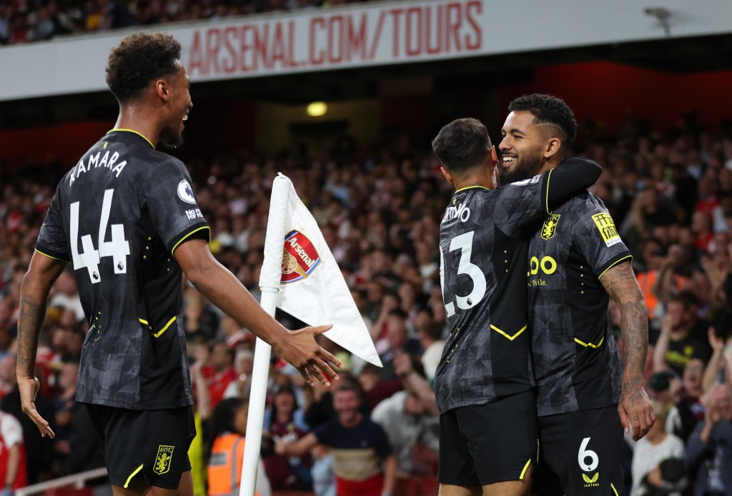 LONDON, ENGLAND - AUGUST 31: Douglas Luiz of Aston Villa celebrates scoring their side's first goal with teammate Philippe Coutinho and Boubacar Kamara during the Premier League match between Arsenal FC and Aston Villa at Emirates Stadium on August 31, 2022 in London, England. (Photo by Catherine Ivill/Getty Images)