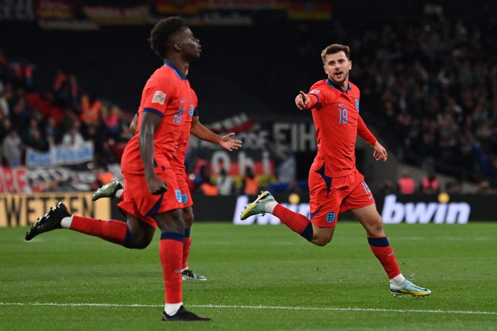 England's midfielder Mason Mount (R) celebrates scoring the team's second goal with England's midfielder Bukayo Saka during the UEFA Nations League group A3 football match between England and Germany at Wembley stadium in north London on September 26, 2022. (Photo by GLYN KIRK/AFP via Getty Images)