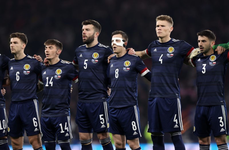GLASGOW, SCOTLAND - MARCH 24: Kieran Tierney, Billy Gilmour, Grant Hanley, Callum McGregor, Scott McTominay and Greg Taylor of Scotland stand for the national anthem prior to the international friendly match between Scotland and Poland at Hampden Park on March 24, 2022 in Glasgow, Scotland. (Photo by Ian MacNicol/Getty Images)