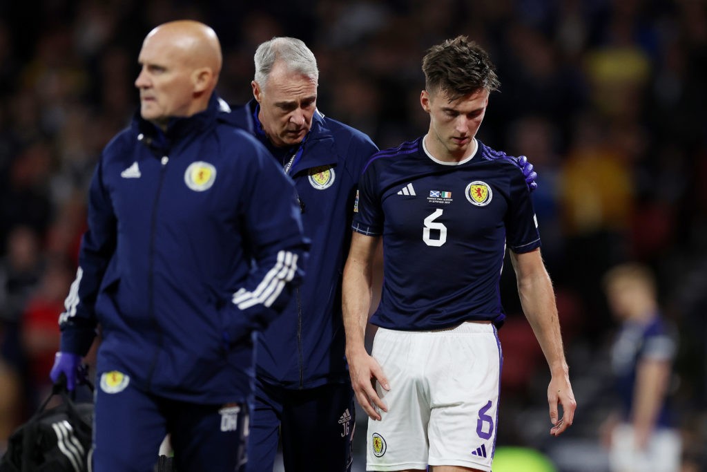 GLASGOW, SCOTLAND - SEPTEMBER 24: Kieran Tierney of Scotland leaves the field after recieving medical treatment during the UEFA Nations League League B Group 1 match between Scotland and Republic of Ireland at Hampden Park National Stadium on September 24, 2022 in Glasgow, Scotland. (Photo by Ian MacNicol/Getty Images)