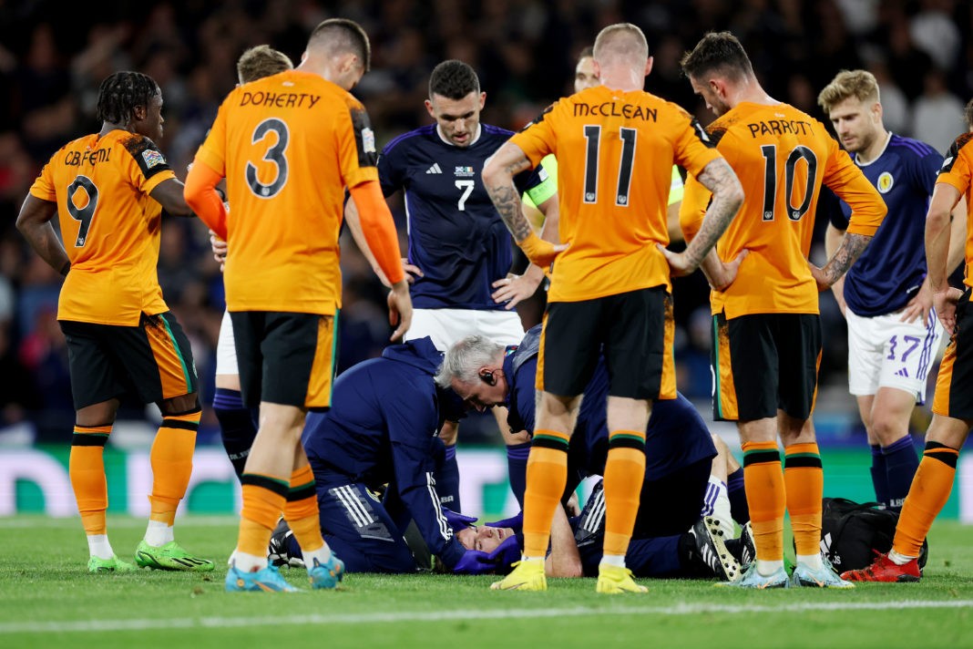 GLASGOW, SCOTLAND - SEPTEMBER 24: Kieran Tierney of Scotland receives medical treatment during the UEFA Nations League League B Group 1 match between Scotland and Republic of Ireland at Hampden Park National Stadium on September 24, 2022 in Glasgow, Scotland. (Photo by Ian MacNicol/Getty Images)