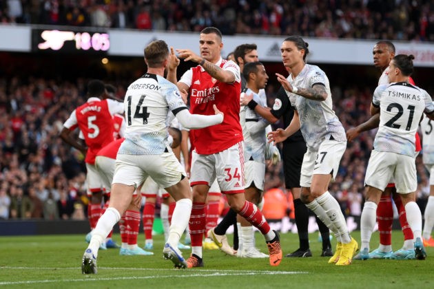 LONDON, ENGLAND - OCTOBER 09: Jordan Henderson of Liverpool clashes with Granit Xhaka of Arsenal after a penalty was given to Arsenal during the Premier League match between Arsenal FC and Liverpool FC at Emirates Stadium on October 09, 2022 in London, England. (Photo by Shaun Botterill/Getty Images)