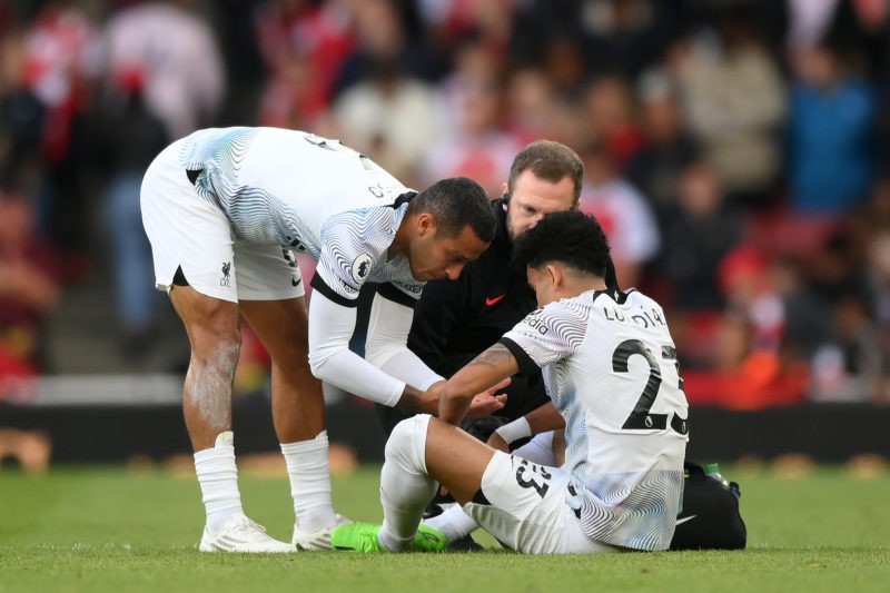 LONDON, ENGLAND - OCTOBER 09: Luis Diaz of Liverpool receives medical treatment before being substituted off during the Premier League match between Arsenal FC and Liverpool FC at Emirates Stadium on October 09, 2022 in London, England. (Photo by Shaun Botterill/Getty Images)
