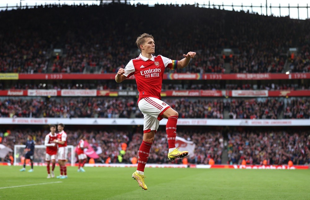 LONDON, ENGLAND: Martin Odegaard of Arsenal of Arsenal celebrates after scoring his side's fifth goal during the Premier League match between Arsenal FC and Nottingham Forest at Emirates Stadium on October 30, 2022. (Photo by Alex Pantling/Getty Images)