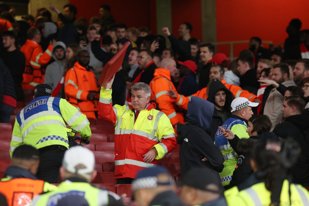 LONDON, ENGLAND - OCTOBER 20: A steward raises a seat as fans clash following the UEFA Europa League group A match between Arsenal FC and PSV Eindhoven at Emirates Stadium on October 20, 2022 in London, England. (Photo by Julian Finney/Getty Images)
