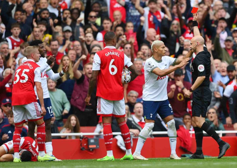 LONDON, ENGLAND - OCTOBER 01: Richarlison of Tottenham Hotspur reacts as match referee Anthony Taylor shows a red card to Emerson Royal of Tottenham Hotspur during the Premier League match between Arsenal FC and Tottenham Hotspur at Emirates Stadium on October 01, 2022 in London, England. (Photo by Shaun Botterill/Getty Images)