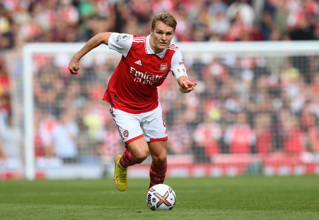 LONDON, ENGLAND - OCTOBER 01: Martin Odegaard of Arsenal runs with the ball during the Premier League match between Arsenal FC and Tottenham Hotspur at Emirates Stadium on October 01, 2022 in London, England. (Photo by Shaun Botterill/Getty Images)