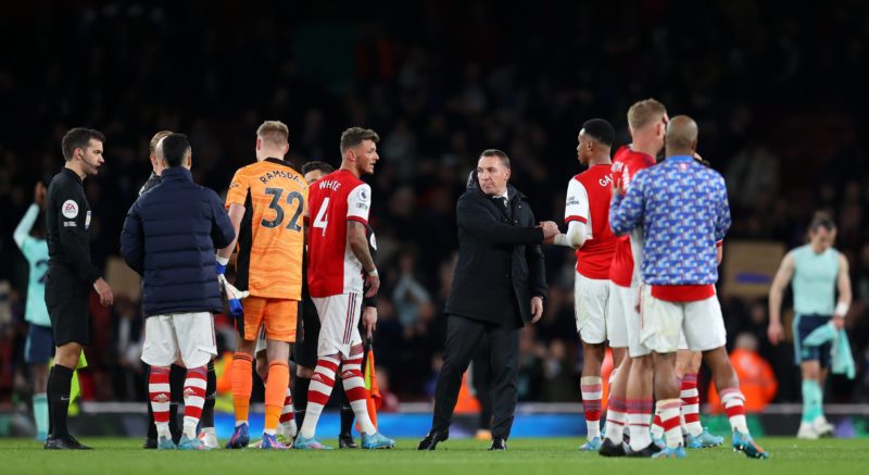 LONDON, ENGLAND - MARCH 13: Brendan Rogers, Manager of Leicester City interacts with Arsenal players following the Premier League match between Arsenal and Leicester City at Emirates Stadium on March 13, 2022 in London, England. (Photo by Catherine Ivill/Getty Images)