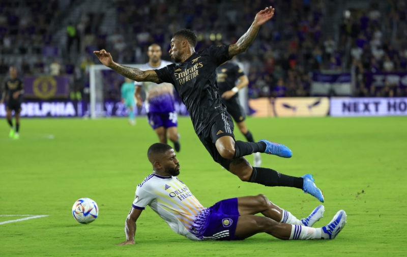 ORLANDO, FLORIDA - JULY 20: Reiss Nelson #24 of Arsenal collides with Ruan #2 of Orlando City during a Florida Cup friendly  at Exploria Stadium on July 20, 2022 in Orlando, Florida. (Photo by Mike Ehrmann/Getty Images)