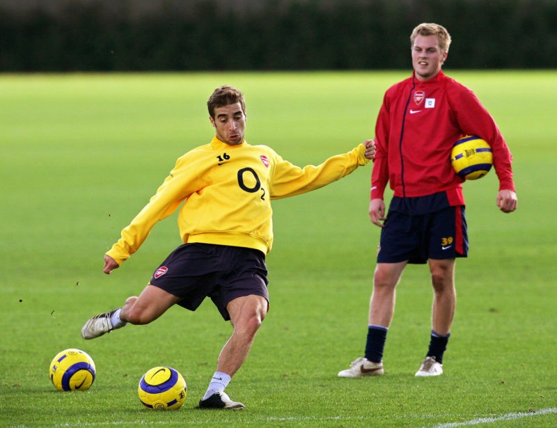 LONDON, United Kingdom: Arsenal's Mathieu Flamini (L) takes a free kick watched by Sebastian Larsson (R) during a training session at the club's training complex in London Colney in North London 01 November 2005. Arsenal will play Czech team Sparta Prague in the Champions League on Wednesday night. (Photo credit ADRIAN DENNIS/AFP via Getty Images)