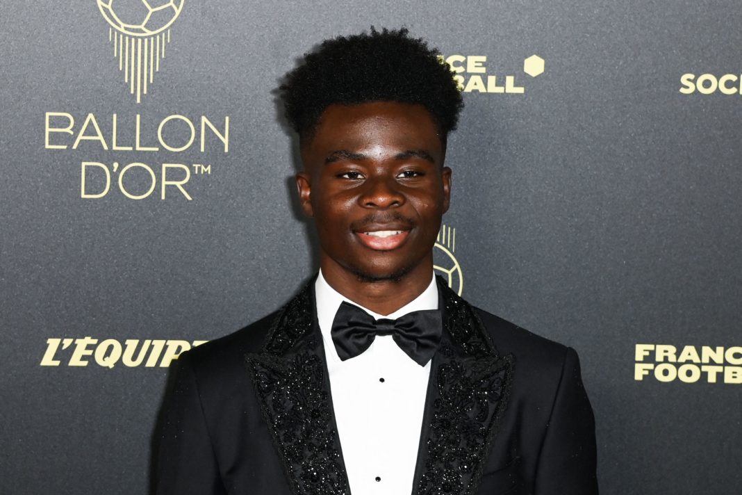 Arsenal's English midfielder Bukayo Saka poses upon arrival to attend the 2022 Ballon d'Or France Football award ceremony at the Theatre du Chatelet in Paris on October 17, 2022. (Photo by Alain JOCARD / AFP) (Photo by ALAIN JOCARD/AFP via Getty Images)