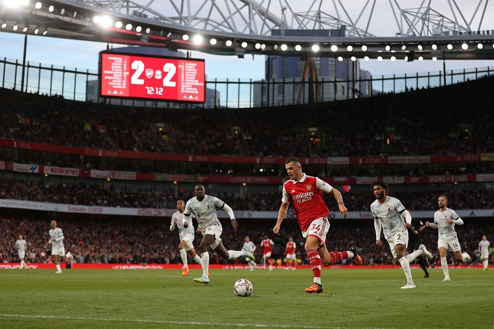 Arsenal's Swiss midfielder Granit Xhaka runs with the ball during the English Premier League football match between Arsenal and Liverpool at the Emirates Stadium in London on October 9, 2022. (Photo by ADRIAN DENNIS/AFP via Getty Images)