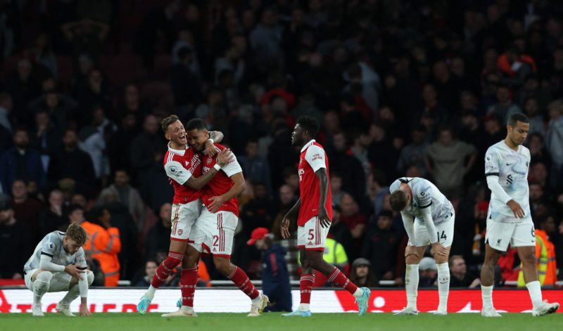 Arsenal's English defender Ben White and Arsenal's French defender William Saliba celebrate winning the English Premier League football match between Arsenal and Liverpool at the Emirates Stadium in London on October 9, 2022. (Photo by ADRIAN DENNIS/AFP via Getty Images)