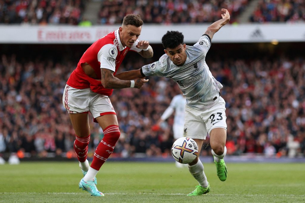 Arsenal's English defender Ben White (L) vies with Liverpool's Colombian midfielder Luis Diaz during the English Premier League football match between Arsenal and Liverpool at the Emirates Stadium in London on October 9, 2022. (Photo by ADRIAN DENNIS/AFP via Getty Images)
