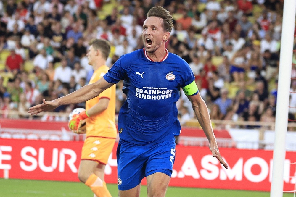PSV Eindhoven's Dutch forward Luuk De Jong celebrates after midfielder Joey Veerman scored a goal during the UEFA Champions League third qualifying round first leg football match between AS Monaco and PSV Eindhoven at the "Louis II Stadium" in Monaco on August 2, 2022. (Photo by VALERY HACHE/AFP via Getty Images)