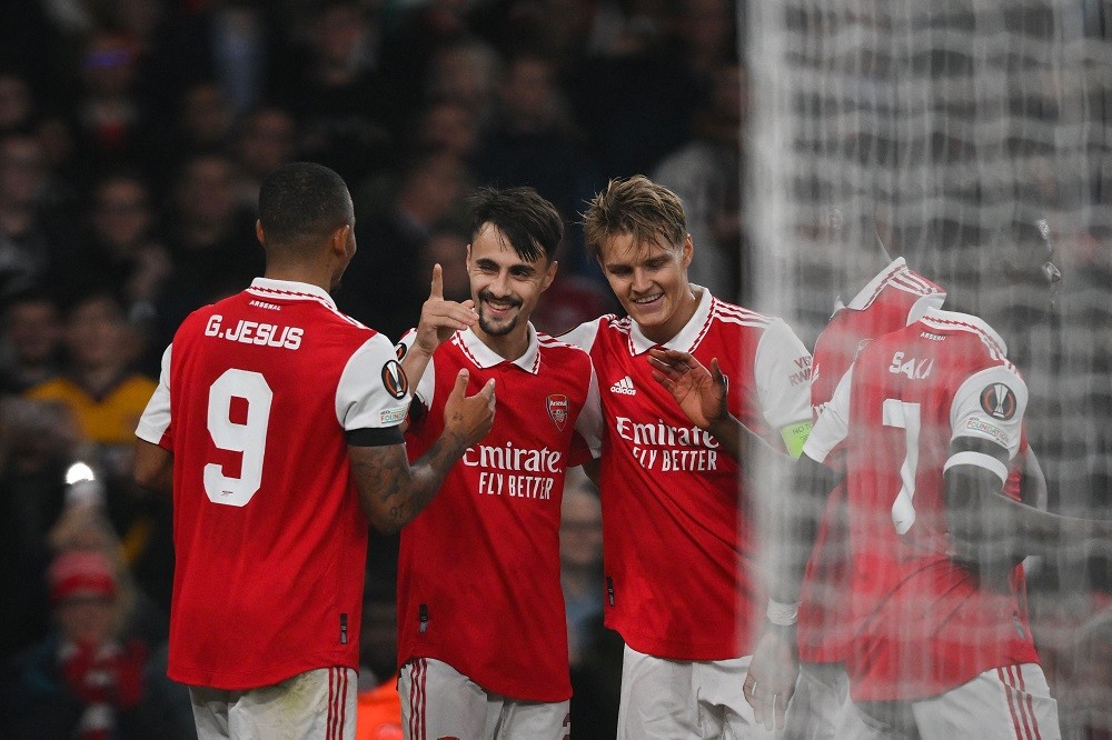 Arsenal's Portuguese midfielder Fabio Vieira (2nd L) celebrates with teammates after scoring his team's third goal during the UEFA Europa League Group A football match between Arsenal and Bodoe/Glimt at The Arsenal Stadium in London, on October 6, 2022. (Photo by DANIEL LEAL/AFP via Getty Images)