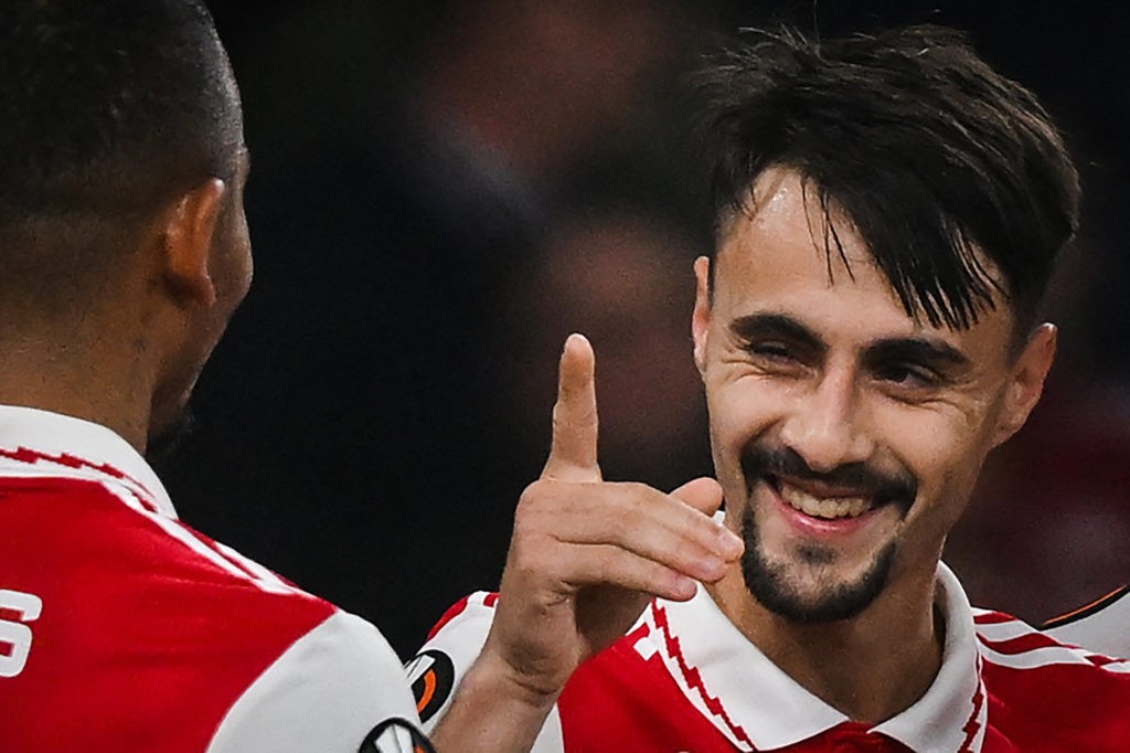 Arsenal's Portuguese midfielder Fabio Vieira (L) celebrates with teammates after scoring his team third goal during the UEFA Europa League Group A football match between Arsenal and Bodoe/Glimt at The Arsenal Stadium in London, on October 6, 2022. (Photo by Daniel LEAL / AFP) (Photo by DANIEL LEAL/AFP via Getty Images)