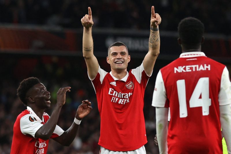 Arsenal's Swiss midfielder Granit Xhaka (C) celebrates with teammates after scoring the opening goal of the UEFA Europa League Group A football match between Arsenal and PSV Eindhoven at The Arsenal Stadium in London, on October 20, 2022. (Photo by ADRIAN DENNIS / AFP) 