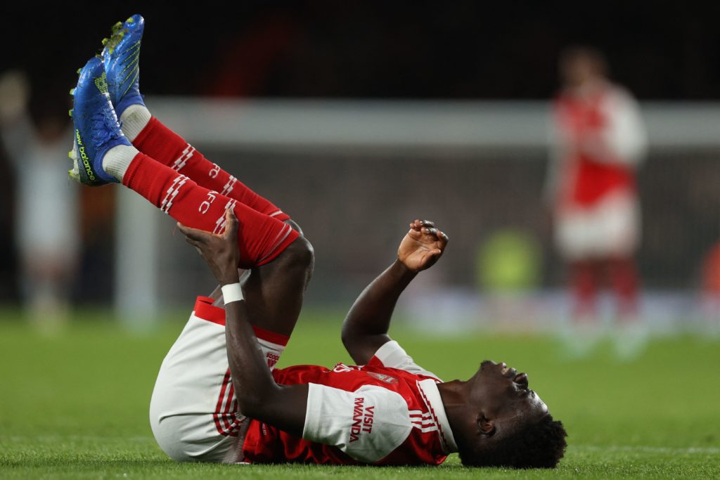 Arsenal's English midfielder Bukayo Saka reacts after appearing to pick up an injury during the UEFA Europa League Group A football match between Arsenal and PSV Eindhoven at The Arsenal Stadium in London, on October 20, 2022. (Photo by ADRIAN DENNIS/AFP via Getty Images)
