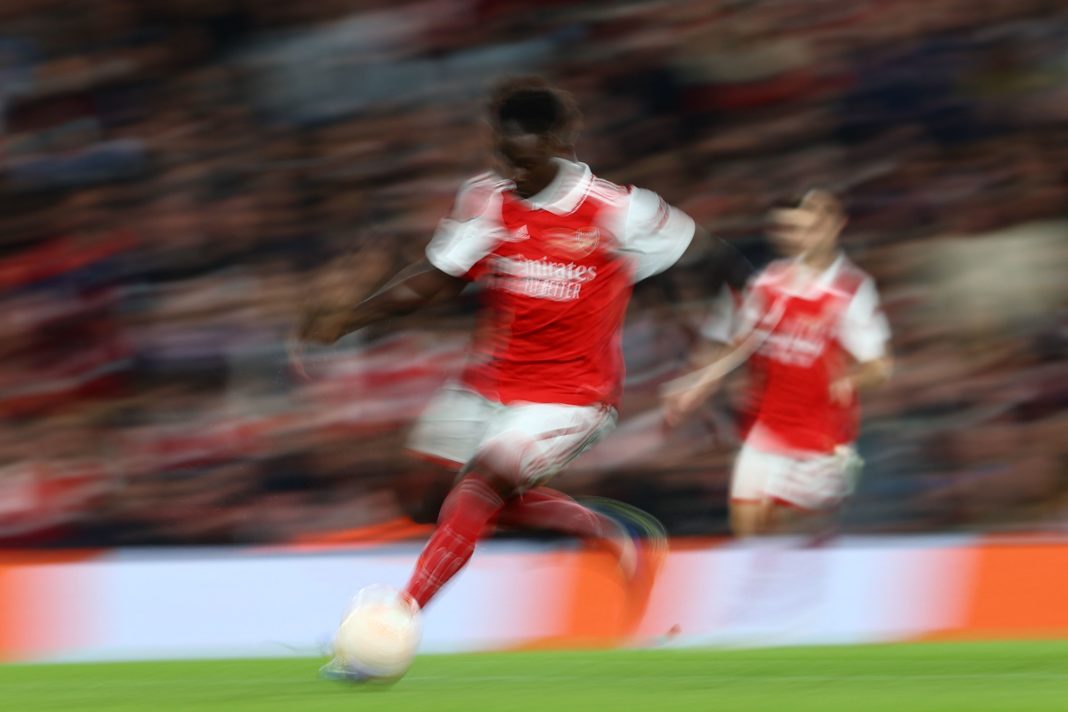 Arsenal's English midfielder Bukayo Saka runs with the ball during the UEFA Europa League Group A football match between Arsenal and PSV Eindhoven at The Arsenal Stadium in London, on October 20, 2022. (Photo by ADRIAN DENNIS/AFP via Getty Images)