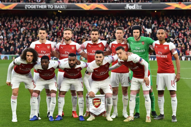 Arsenal players (back row L-R) Arsenal's Swiss midfielder Granit Xhaka, Arsenal's German defender Shkodran Mustafi, Arsenal's Greek defender Sokratis Papastathopoulos, Arsenal's French defender Laurent Koscielny, Arsenal's Czech goalkeeper Petr Cech and Arsenal's Gabonese striker Pierre-Emerick Aubameyang (front row L-R) Arsenal's French midfielder Matteo Guendouzi, Arsenal's English midfielder Ainsley Maitland-Niles, Arsenal's French striker Alexandre Lacazette, Arsenal's German-born Bosnian defender Sead Kolasinac and Arsenal's German midfielder Mesut Ozil pose for a pre-game photograph before the UEFA Europa League semi final, first leg, football match between Arsenal and Valencia at the Emirates Stadium in London on May 2, 2019.(Photo credit GLYN KIRK/AFP via Getty Images)