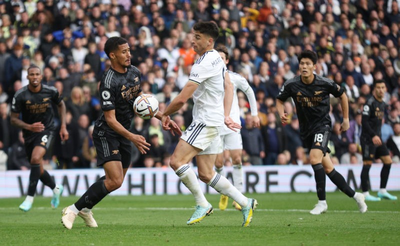 LEEDS, ENGLAND - OCTOBER 16: William Saliba of Arsenal handles the ball in the box, which leads to a Leeds United penalty after a VAR check during the Premier League match between Leeds United and Arsenal FC at Elland Road on October 16, 2022 in Leeds, England. (Photo by Eddie Keogh/Getty Images)