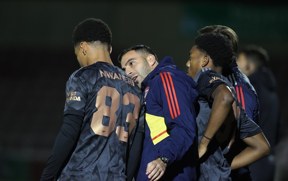 NORTHAMPTON, ENGLAND: Arsenal U21 manager Mehmet Ali makes a point to Ethan Nwaneri prior to coming on as a substitute during the Papa John's Trophy match between Northampton Town and Arsenal U21 at Sixfields on October 18, 2022. (Photo by Pete Norton/Getty Images)