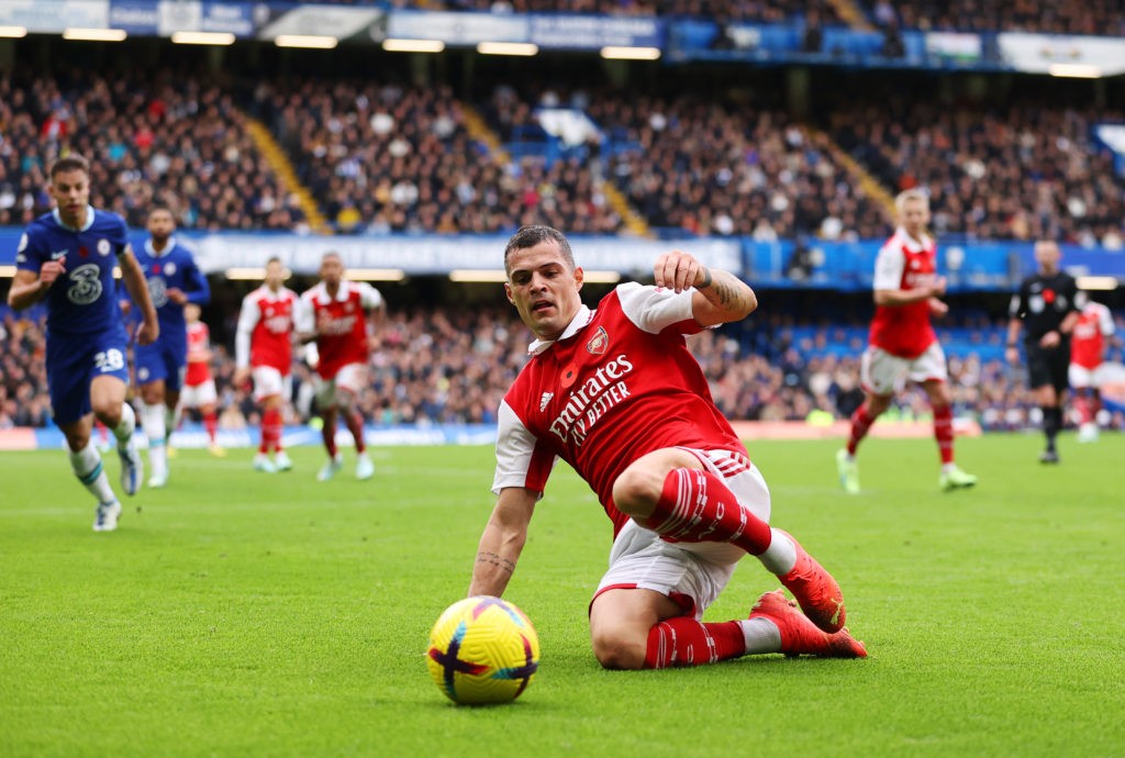 LONDON, ENGLAND - NOVEMBER 06: Granit Xhaka of Arsenal slides for the ball during the Premier League match between Chelsea FC and Arsenal FC at Stamford Bridge on November 06, 2022 in London, England. (Photo by Ryan Pierse/Getty Images)