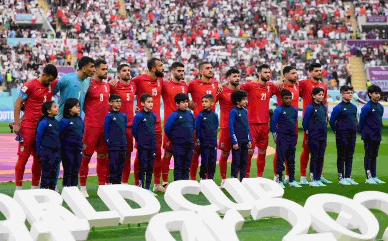 DOHA, QATAR - NOVEMBER 21: Iranian players line up for the national anthem prior to the FIFA World Cup Qatar 2022 Group B match between England and IR Iran at Khalifa International Stadium on November 21, 2022 in Doha, Qatar. (Photo by Matthias Hangst/Getty Images)