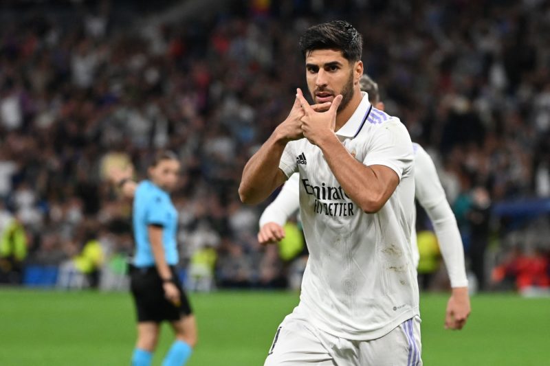 Real Madrid's Spanish midfielder Marco Asensio celebrates after scoring his team's fourth goal during the UEFA Champions League 1st round day 6 Group F football match between Real Madrid CF and Celtic FC at the Santiago Bernabeu stadium in Madrid on November 2, 2022. (Photo by PIERRE-PHILIPPE MARCOU/AFP via Getty Images)