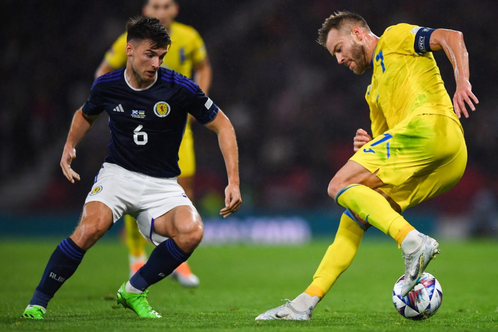 Scotland's defender Kieran Tierney (L) fights for the ball with Ukraine's midfielder Andriy Yarmolenko during the UEFA Nations League B Group 1 football match at Hampden Park stadium, in Glasgow, on September 21, 2022. (Photo by ANDY BUCHANAN/AFP via Getty Images)