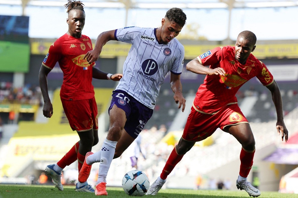 Toulouse midfielder Fares Chaibi (right) tackles Angers defender Ibrahim Amadou (right) for the ball during the French L1 football match between Toulouse FC and SCO Angers at the TFC Stadium in Toulouse, southwest France, on October 16, 2022.  (Photo: CHARLY) TRIBALLLEAU/AFP via Getty Images)
