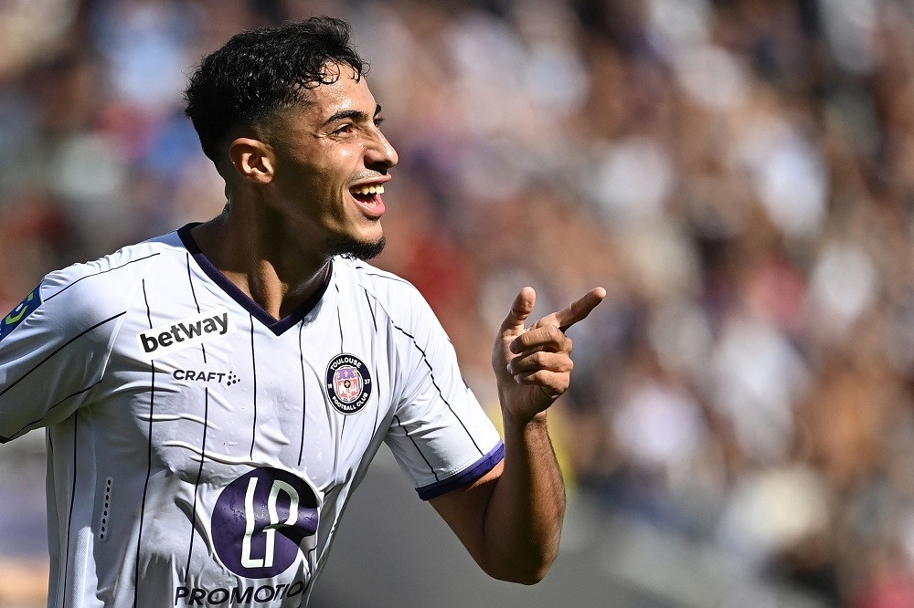 Toulouse's French midfielder Fares Chaibi celebrates scoring his team's third goal during the French L1 football match between Toulouse FC and Montpellier Herault SC at Stadium TFC in Toulouse, southwestern France, on October 2, 2022. (Photo by LIONEL BONAVENTURE/AFP via Getty Images)