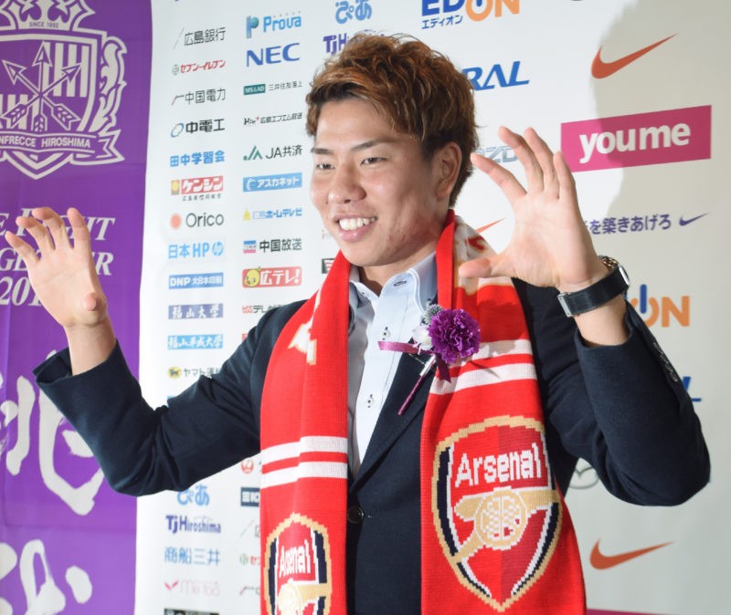 J-League Sanfrecce Hiroshima forward Takuma Asano poses for the media in Hiroshima on July 4, 2016. (Photo read JIJI PRESS/AFP via Getty Images)