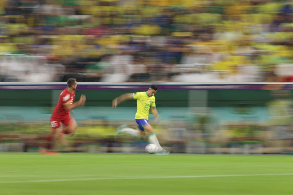 Brazil's forward Gabriel Martinelli (R) runs with the ball during the Qatar 2022 World Cup Group G football match between Brazil and Serbia at the Lusail Stadium in Lusail, north of Doha on November 24, 2022. (Photo by ADRIAN DENNIS/AFP via Getty Images)
