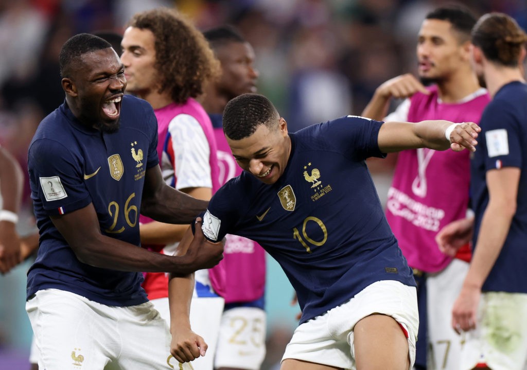 DOHA, QATAR - DECEMBER 04: Marcus Thuram of France and Kylian Mbappe of France celebrates after the FIFA World Cup Qatar 2022 Round of 16 match between France and Poland at Al Thumama Stadium on December 04, 2022 in Doha, Qatar. (Photo by Francois Nel/Getty Images)